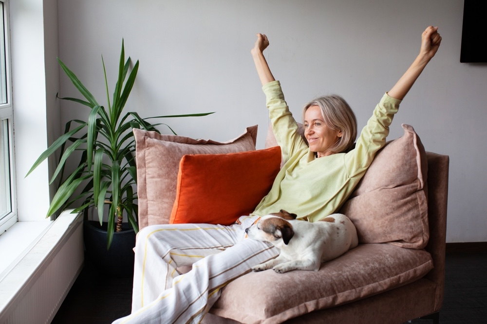 middle aged woman relaxing on sofa at home