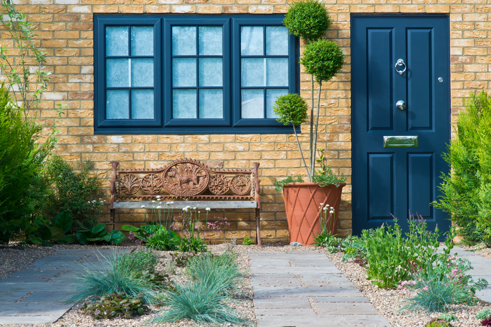 Front of English House with pots and bench