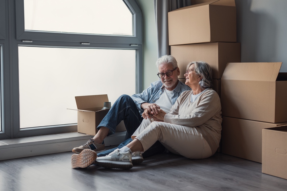 Older couple sharing a quiet moment during a house move
