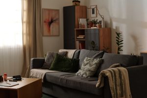 Stylish living room featuring green and gray furnishings with modern art on walls