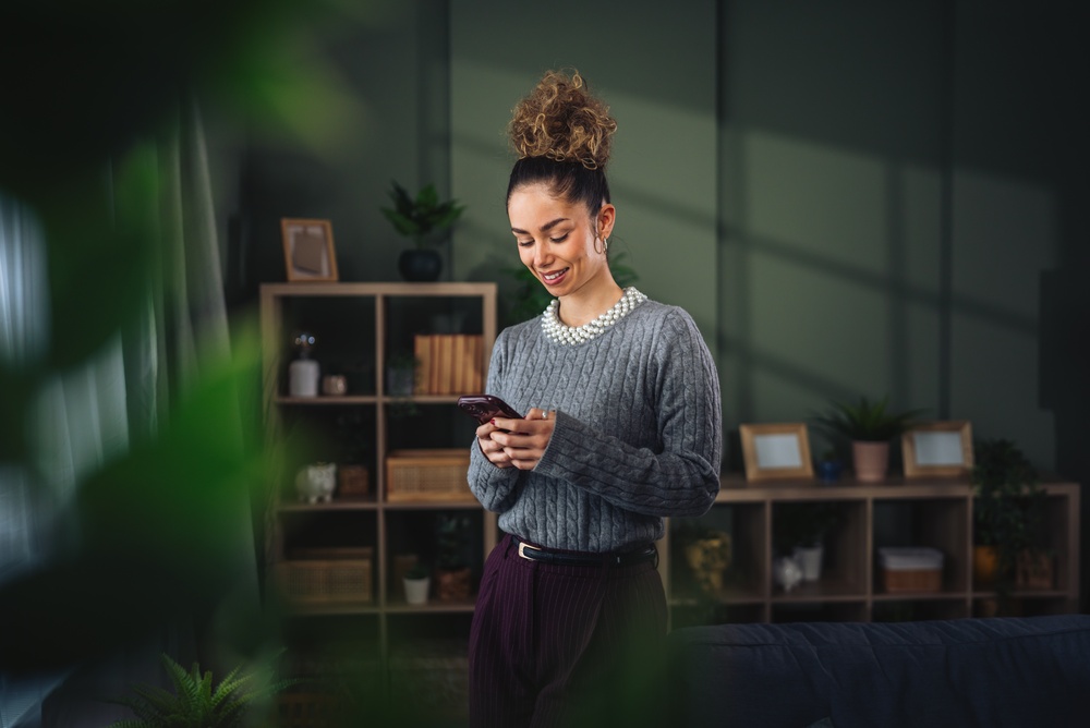 Young woman standing in a cozy living room