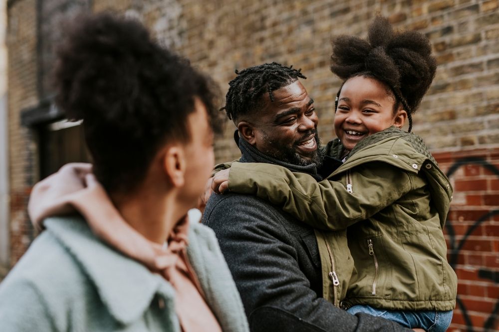 Father enjoys quality time with his daughter and wife